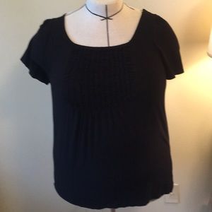 INC 1X black top with ruffle.
